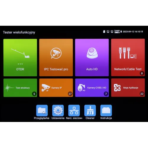 Ekran testera wielofunkcyjnego z kolorowymi ikonami aplikacji, takimi jak OTDR, IPC Testowač pro, Auto HD, Network/Cable Test, oraz inne narzędzia. Na dole ekranu znajdują się dodatkowe opcje, takie jak Przeglądarka, Ustawienia, Narz. sieciowe, Cleaner i Instrukcja.