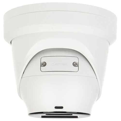 Biała kamera IP w kształcie kopuły z widocznymi elementami montażowymi i napisem "SETTING". Kamera ma minimalistyczny design i jest przeznaczona do monitoringu.