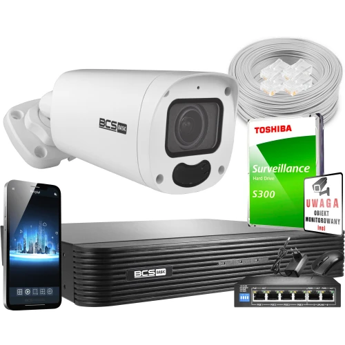 Na zdjęciu znajduje się zestaw do monitoringu, w skład którego wchodzą kamera BCS Basic, rejestrator, dysk twardy Toshiba, kabel sieciowy, przełącznik oraz znak ostrzegawczy. Obok zestawu widoczny jest również smartfon z aplikacją do monitoringu.