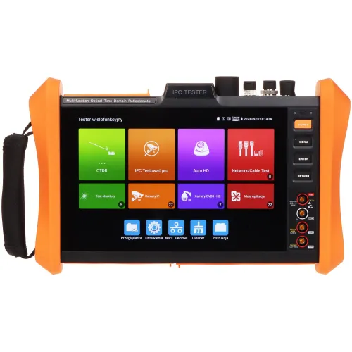 Na zdjęciu znajduje się urządzenie testowe z kolorowym ekranem dotykowym, na którym wyświetlane są różne ikony aplikacji. Obudowa urządzenia jest pomarańczowa z czarnymi elementami, a po prawej stronie znajdują się przyciski funkcyjne.