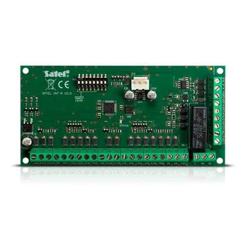 Zdjęcie przedstawia zieloną płytkę drukowaną z różnymi komponentami elektronicznymi, w tym złączami i układami scalonymi. Produkt to uniwersalny ekspander czytnikowy marki Satel, model INT-R v2.0.