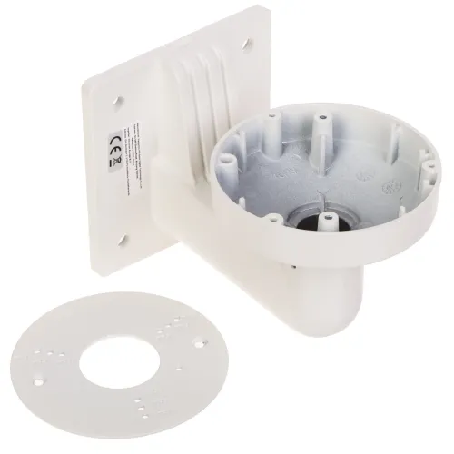 Na zdjęciu znajduje się biały uchwyt montażowy do kamer, z okrągłą podstawą i prostokątną płytą mocującą. Obok uchwytu leży okrągła metalowa płytka z otworami montażowymi.