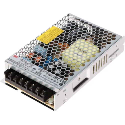 Zasilacz impulsowy LRS-150-24 Mean Well z metalową obudową i siatkowym wzorem na górze. Widoczne są oznaczenia techniczne oraz zaciski do podłączenia przewodów.