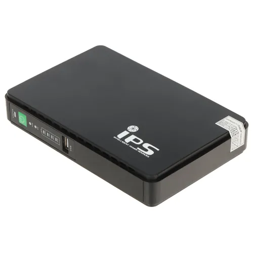 Czarny zasilacz UPS z logo "IPS" na górze, posiadający porty USB i wskaźniki LED na przednim panelu. Urządzenie ma prostokątny kształt i kompaktowy design.