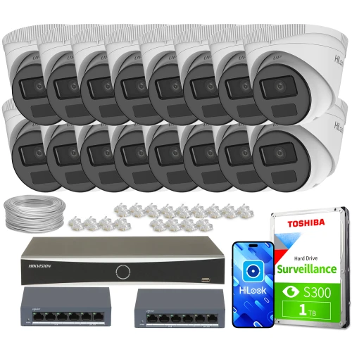 Zestaw do monitoringu składający się z szesnastu kamer kopułkowych, rejestratora, dwóch switchów, dysku twardego oraz akcesoriów montażowych. Kamery i sprzęt są ułożone na białym tle, prezentując kompletny system nadzoru.