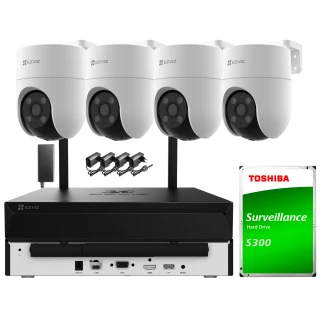 Na zdjęciu znajduje się zestaw do monitoringu, składający się z czterech białych kamer Wi-Fi, rejestratora oraz dysku twardego Toshiba S300. Kamery są zamontowane na czarnych uchwytach, a rejestrator posiada różne porty i złącza na przednim panelu.