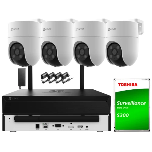 Na zdjęciu znajduje się zestaw do monitoringu, składający się z czterech białych kamer Wi-Fi, rejestratora oraz dysku twardego Toshiba S300. Kamery są zamontowane na czarnych uchwytach, a rejestrator posiada różne porty i złącza na przednim panelu.