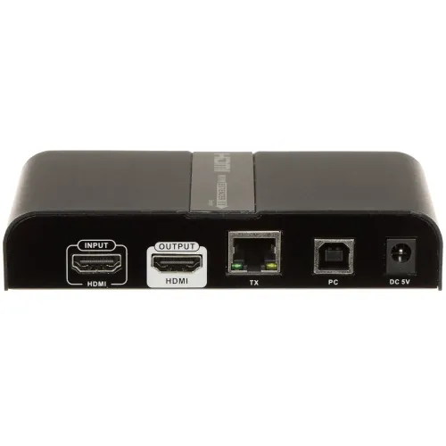 Na zdjęciu znajduje się czarny panel z różnymi złączami, w tym dwa porty HDMI oznaczone jako "INPUT" i "OUTPUT", port Ethernet oznaczony jako "TX", port PC oraz gniazdo zasilania DC 5V. Panel jest częścią urządzenia elektronicznego, prawdopodobnie nadajnika lub odbiornika sygnału.
